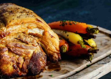 a chuck roast with roasted veggies on the side